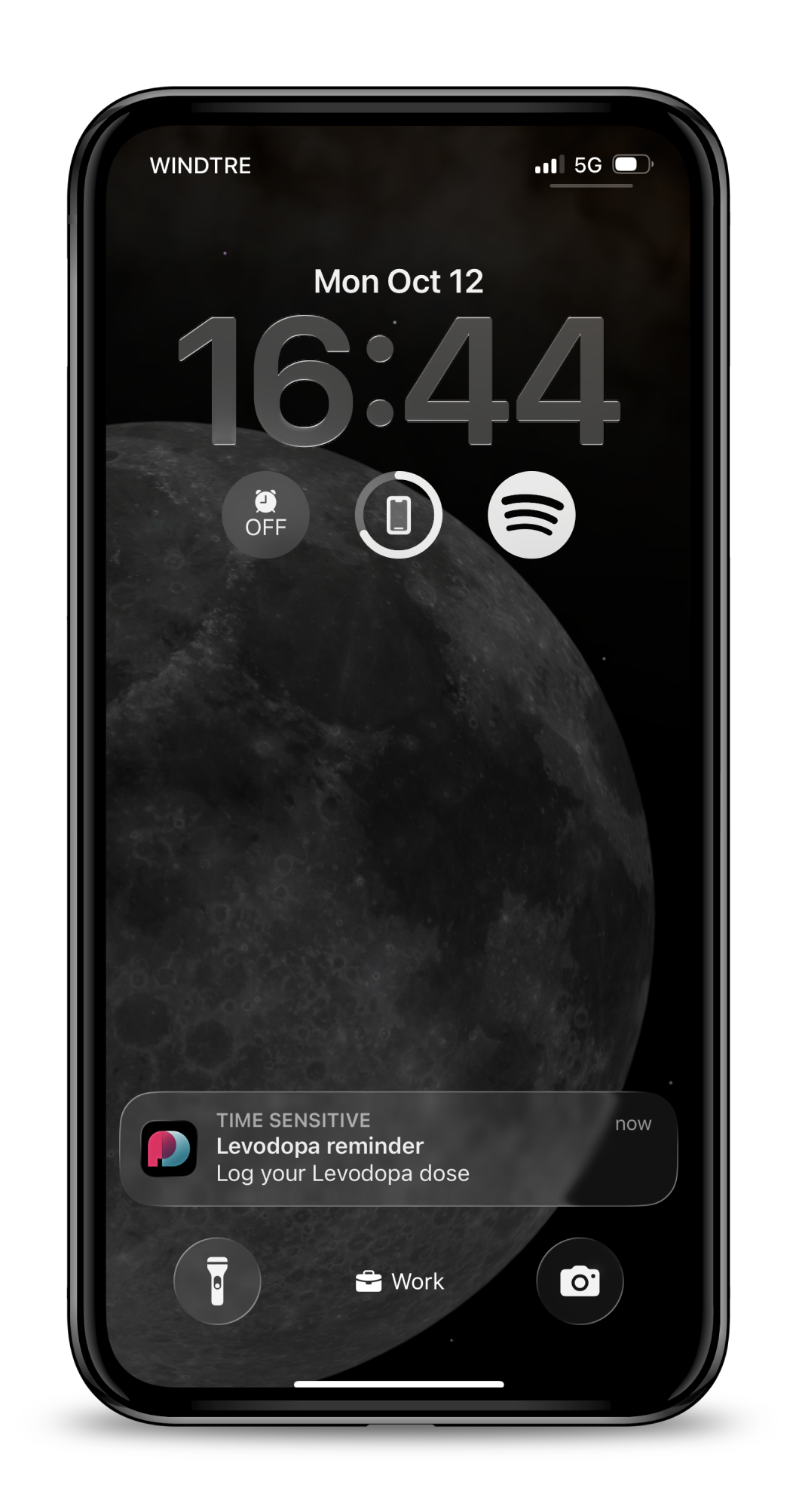 Lock screen showing a WellPD App reminder notification: Levodopa reminder, Log your Levodopa dose