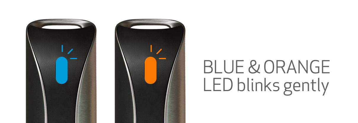 The WellPD wearable with its LED blinking blue and orange